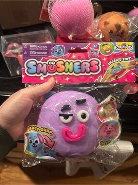 Orb Curiosities Purple Smushers Face-Swap Squishy Toy with Pink Mouth